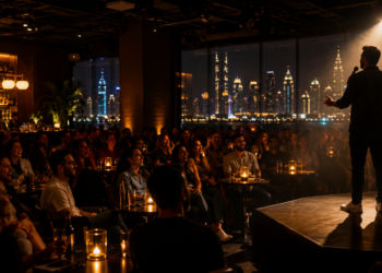 Live stand-up comedy night in Dubai with audience laughter and warm stage lights