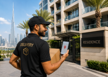 Courier delivery outside a Dubai apartment building for a guide explaining Dubai postcodes and ZIP codes