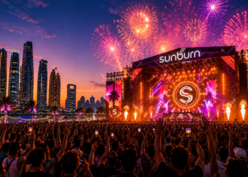 Illustration of an electronic music festival crowd and fireworks for Sunburn Festival Abu Dhabi 2026.
